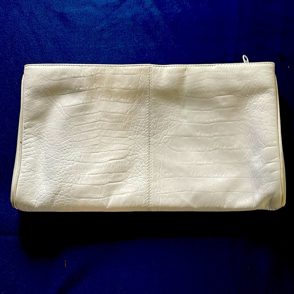 A real leather bag. In good condition. White.